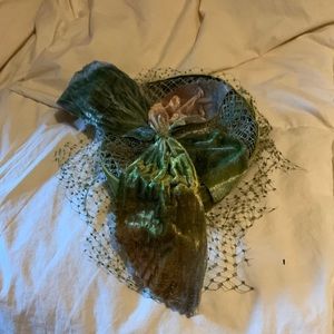 Vintage, beautiful green velvet pillbox hat with green netting.